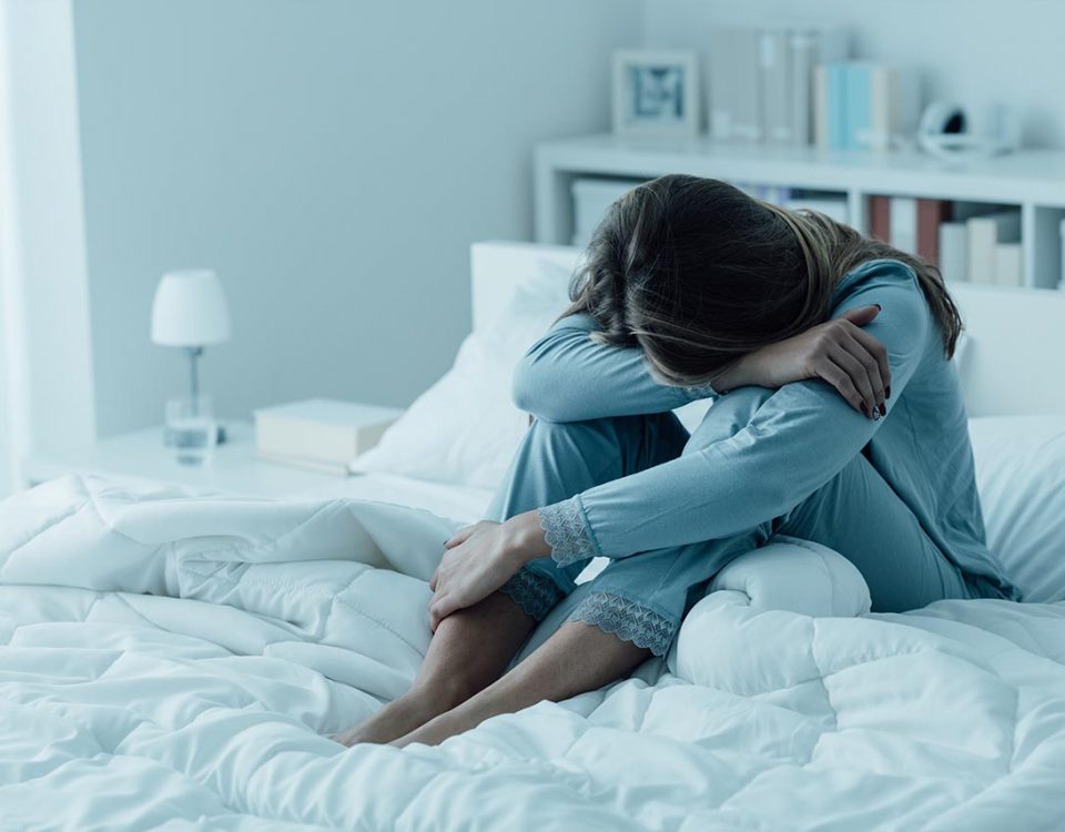 woman with depression in bed